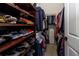 Walk-in closet features custom shelving for shoes, hanging space, and organized storage at 12337 Rose Haven Blvd, New Port Richey, FL 34654