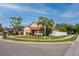 Charming corner lot home featuring manicured landscaping, mature trees, and a white picket fence at 12337 Rose Haven Blvd, New Port Richey, FL 34654