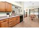 Bright kitchen with a breakfast bar, tile flooring, and easy access to the dining area at 12337 Rose Haven Blvd, New Port Richey, FL 34654