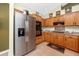 Well-equipped kitchen featuring stainless steel appliances, ample counter space, and oak cabinetry at 12337 Rose Haven Blvd, New Port Richey, FL 34654