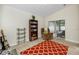 Spacious living room with plush recliner, sliding glass doors and vaulted ceilings at 12337 Rose Haven Blvd, New Port Richey, FL 34654