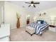 Serene main bedroom with vaulted ceiling, carpet, and stylish decor at 12337 Rose Haven Blvd, New Port Richey, FL 34654