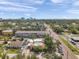 An aerial view capturing the property's neighborhood near a bustling street with views of the city skyline at 1269 Drew St, Clearwater, FL 33755