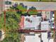 Overhead view of home with red-lined property boundaries, mature trees and updated roof at 1269 Drew St, Clearwater, FL 33755