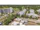 An aerial shot of the neighborhood including the building, homes, street, and golf course in the distance at 1269 Drew St, Clearwater, FL 33755
