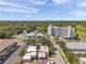 The neighborhood is visible with an aerial view of the building, showcasing location near a golf course at 1269 Drew St, Clearwater, FL 33755