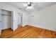 Bedroom with hardwood floors, a ceiling fan, and a closet at 1269 Drew St, Clearwater, FL 33755