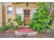 Inviting front door, well-maintained landscaping, and vintage decor at 1269 Drew St, Clearwater, FL 33755