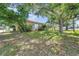 Charming single-story home with a well-maintained lawn and mature trees offering ample shade at 1269 Drew St, Clearwater, FL 33755