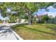 Charming single-story home with mature trees in the front yard providing great curb appeal and shade at 1269 Drew St, Clearwater, FL 33755