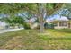Charming single-story home with mature trees in the front yard providing great curb appeal and shade at 1269 Drew St, Clearwater, FL 33755