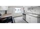 Kitchen with a stainless steel dishwasher and a double basin sink at 1269 Drew St, Clearwater, FL 33755