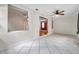 Spacious, bright room with tile flooring, ceiling fan, and view to next room at 1269 Drew St, Clearwater, FL 33755