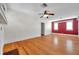 Bright living room featuring hardwood floors and fresh white paint at 1269 Drew St, Clearwater, FL 33755