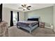 Comfortable bedroom with ceiling fan, carpet flooring, and window at 12838 Wildflower Meadow Dr, Riverview, FL 33579