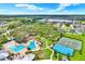 Aerial view of community amenities including pool, water park, and tennis courts in a Gathering-friendly neighborhood at 12838 Wildflower Meadow Dr, Riverview, FL 33579