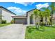Charming single-Gathering home with a well-maintained lawn and landscaping at 12838 Wildflower Meadow Dr, Riverview, FL 33579