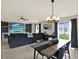 Open concept living space with modern décor, backyard views, and a dining area at 12838 Wildflower Meadow Dr, Riverview, FL 33579