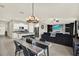 Bright living area with open kitchen, dining, and lounge, perfect for entertaining at 12838 Wildflower Meadow Dr, Riverview, FL 33579