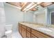 Bathroom featuring a double vanity with a granite countertop and shower at 13702 Sweetwater Cove Pl # 25, Tampa, FL 33613