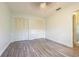 This bedroom offers wood flooring and two closets providing ample storage space at 13702 Sweetwater Cove Pl # 25, Tampa, FL 33613