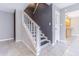 Entryway featuring stairs to the upper level and tile flooring at 13702 Sweetwater Cove Pl # 25, Tampa, FL 33613