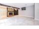 Inviting living room featuring a stone fireplace and neutral tile flooring at 13702 Sweetwater Cove Pl # 25, Tampa, FL 33613