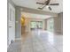 This home features a spacious living space with large sliding glass doors and tile flooring at 13702 Sweetwater Cove Pl # 25, Tampa, FL 33613