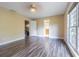 Spacious main bedroom with wood-look floors and ample natural light at 13702 Sweetwater Cove Pl # 25, Tampa, FL 33613