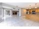 Bright, open floorplan with large tiled floors, a living room and a kitchen at 13702 Sweetwater Cove Pl # 25, Tampa, FL 33613