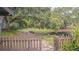 A tranquil view of the pond, featuring a classic picket fence at 13702 Sweetwater Cove Pl # 25, Tampa, FL 33613