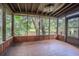 Relaxing screened porch with views of lush greenery and a peaceful pond at 13702 Sweetwater Cove Pl # 25, Tampa, FL 33613