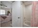 Bedroom with an ensuite bathroom including a shower and tub combination at 13851 Lake Point Dr, Clearwater, FL 33762