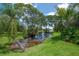 Scenic creek with lush greenery and tall trees provides a tranquil view and natural setting at 13851 Lake Point Dr, Clearwater, FL 33762