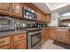 Kitchen boasts stainless steel appliances and wood cabinets at 13851 Lake Point Dr, Clearwater, FL 33762
