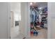 Large walk-in closet for clothing and accessories at 13851 Lake Point Dr, Clearwater, FL 33762