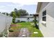 Fully fenced backyard with well manicured landscaping and a rock garden path at 1806 11Th Sw St, Largo, FL 33778
