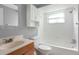 Light and airy bathroom with neutral colors, built-in storage, and shower at 1806 11Th Sw St, Largo, FL 33778