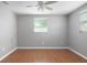 A bedroom with wood flooring, neutral walls, and natural light at 1806 11Th Sw St, Largo, FL 33778