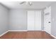 A bedroom with hardwood floors and a closet at 1806 11Th Sw St, Largo, FL 33778