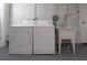 Laundry room featuring a washer, dryer, utility sink, and neutral walls at 1806 11Th Sw St, Largo, FL 33778
