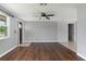 Spacious living area with wood-look floors and neutral paint, providing a versatile space at 1806 11Th Sw St, Largo, FL 33778