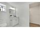 Bright bathroom with a modern vanity and a toilet, next to the walk-in closet at 19003 Cedar Ln, Lutz, FL 33548