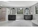 Luxurious bathroom featuring dual vanities, marble accents, and a separate shower and tub at 19003 Cedar Ln, Lutz, FL 33548