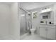 Modern bathroom featuring a glass-enclosed shower, stylish vanity, and contemporary fixtures for a spa-like experience at 19003 Cedar Ln, Lutz, FL 33548