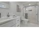 Modern bathroom with glass-enclosed shower, updated vanity, and stylish fixtures at 19003 Cedar Ln, Lutz, FL 33548