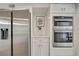 Bright kitchen featuring stainless steel refrigerator and double oven at 19003 Cedar Ln, Lutz, FL 33548