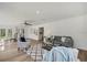Bright living room with modern decor, wood flooring, and a cozy seating area at 19003 Cedar Ln, Lutz, FL 33548