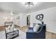 Modern living room with stylish decor, hardwood floors, and unique lighting, creating a comfortable and inviting space at 19003 Cedar Ln, Lutz, FL 33548