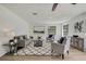 Spacious living room with hardwood floors, light gray furniture, and natural light at 19003 Cedar Ln, Lutz, FL 33548